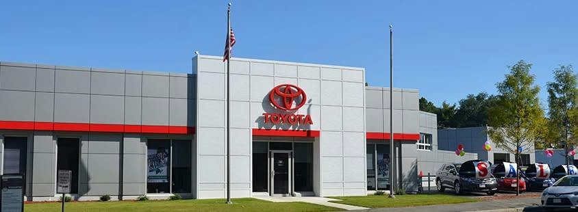 Customers outside a Toyota dealership