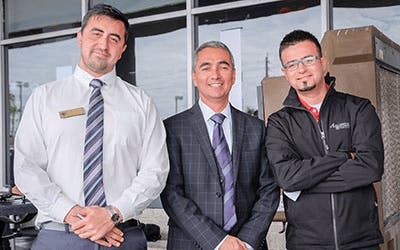Customers outside a Toyota dealership