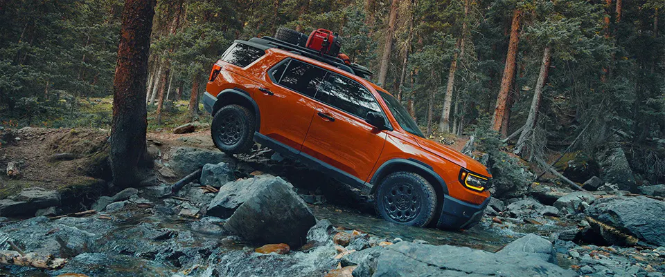 2026 Honda Passport driving outdoors