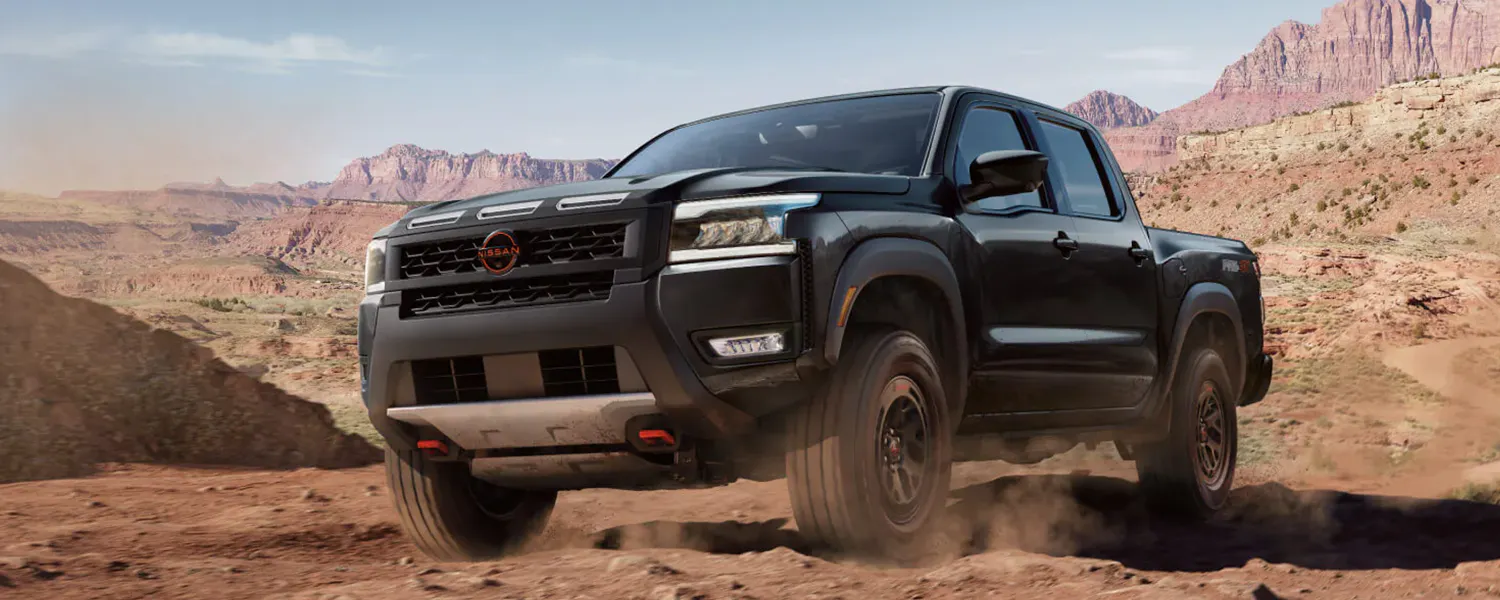 2026 Nissan Frontier driving over rough terrain
