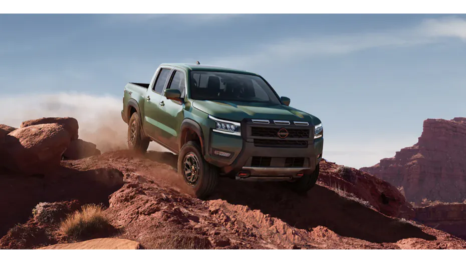Nissan Frontier driving on a rugged road